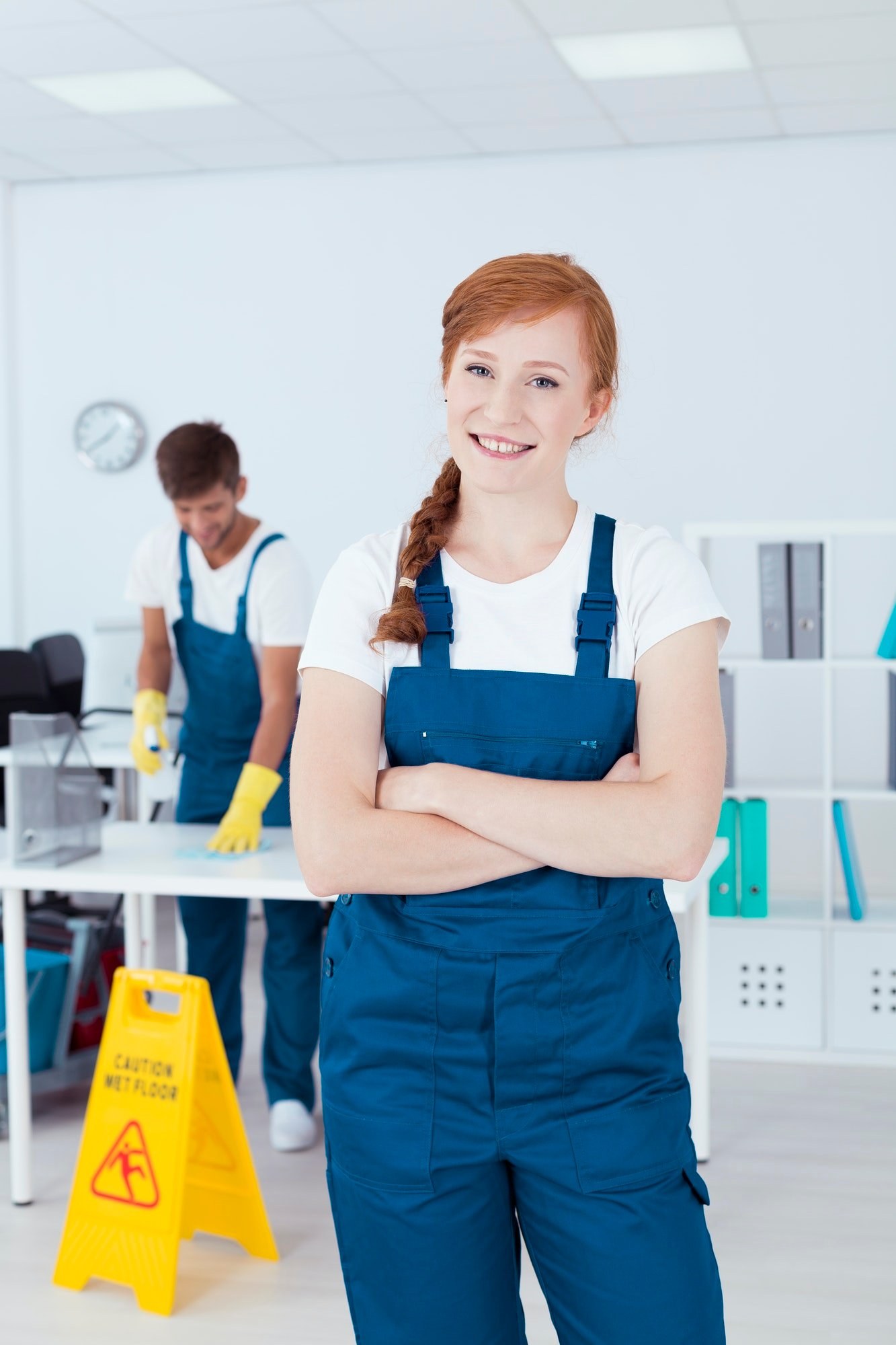 Smiling cleaner in an office